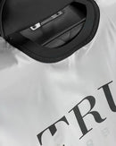 TRUBARBER PROFESSIONAL BARBER CAPE – White With Black Letters